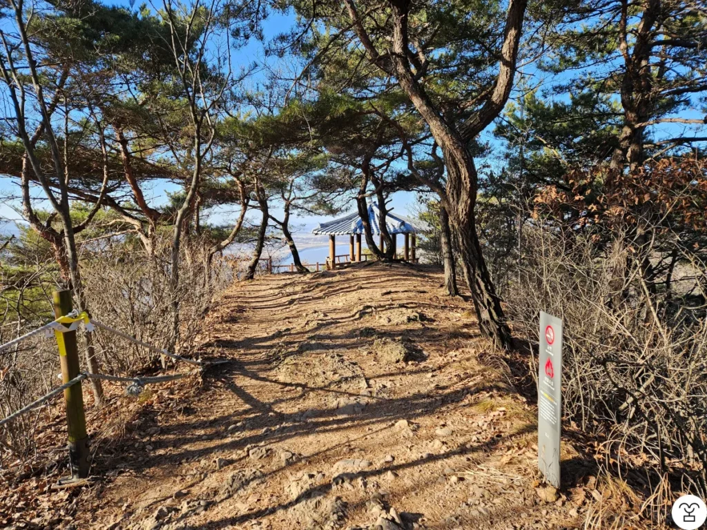 Turning back toward the observatory to descend