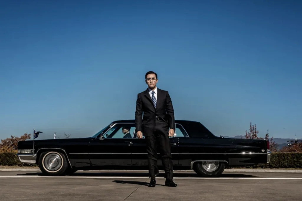 Film still from The Man Standing Next