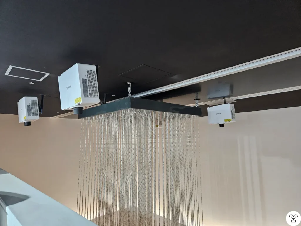 This is not an artwork. The projector is turned off.